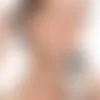 Applying Nuvella serum to the face